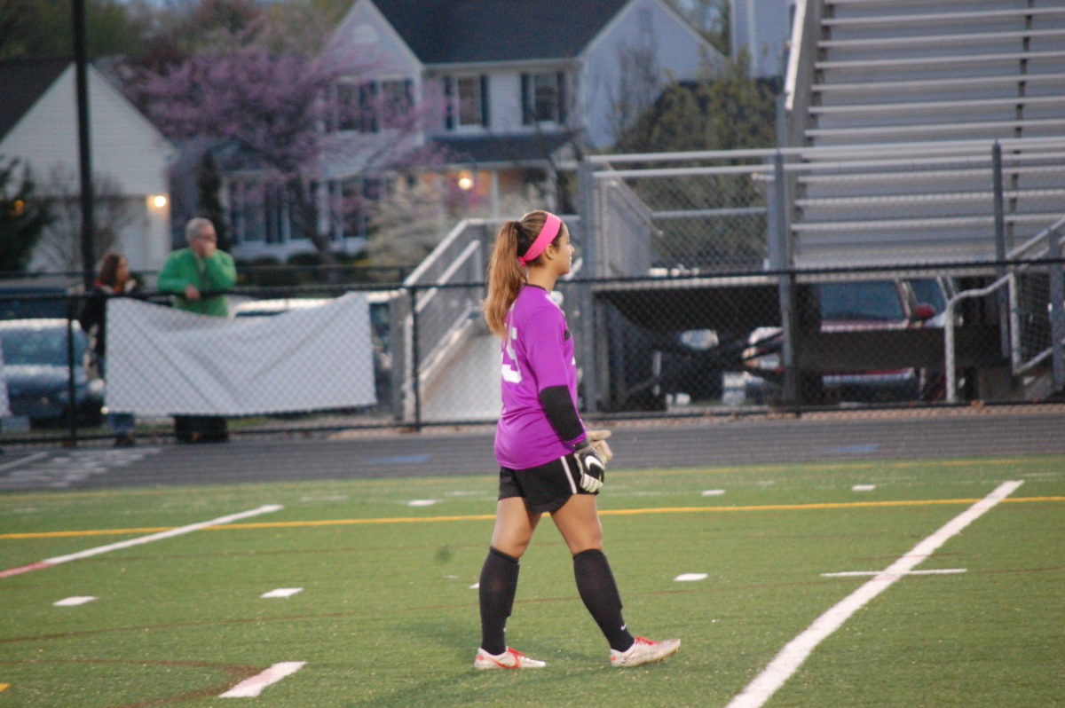 Challenged early, Broad Run junior goalie Emma Magness gave her team a chance in the second half, shutting out the Stone Bridge attack throughout the first 40. Photo by Owen Gotimer.