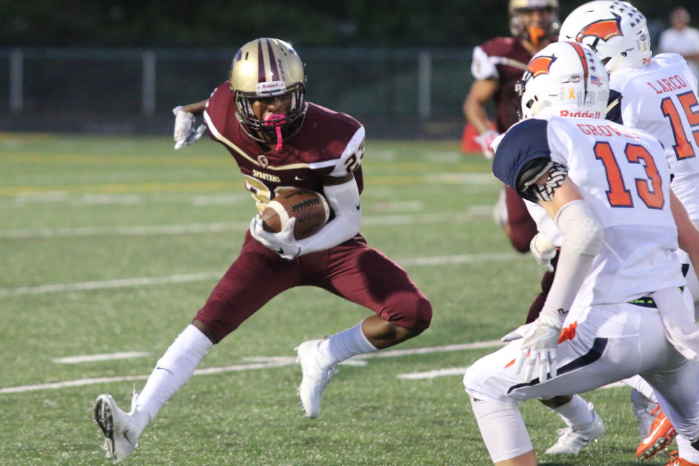 Broad Run junior receiver Ibn Earl not only made an open field tackle on the game's opening kickoff, but also forced a fumble and then pounced on it. Photo by Dave Harmon.