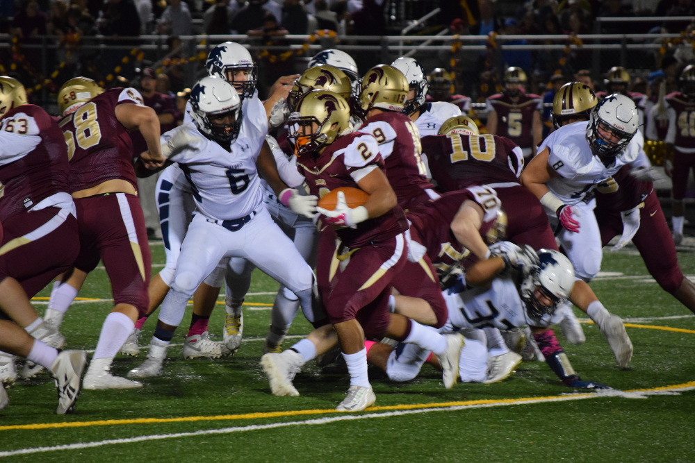 For just the first time in nearly 11 months, Broad Run senior running back Meech Hembry was held to under 100 yards on the ground, but half of his 170 all-purpose yards came at the right time for the Spartans. Full photo gallery by Drew Woodford and Owen Gotimer!