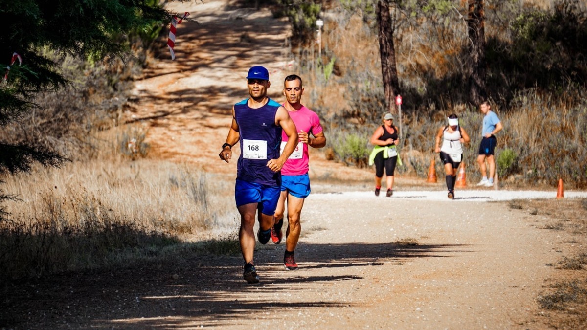 Adults running in cross country race