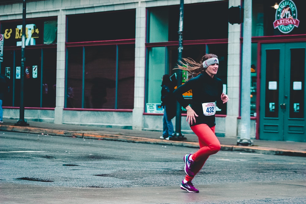 Female running down street