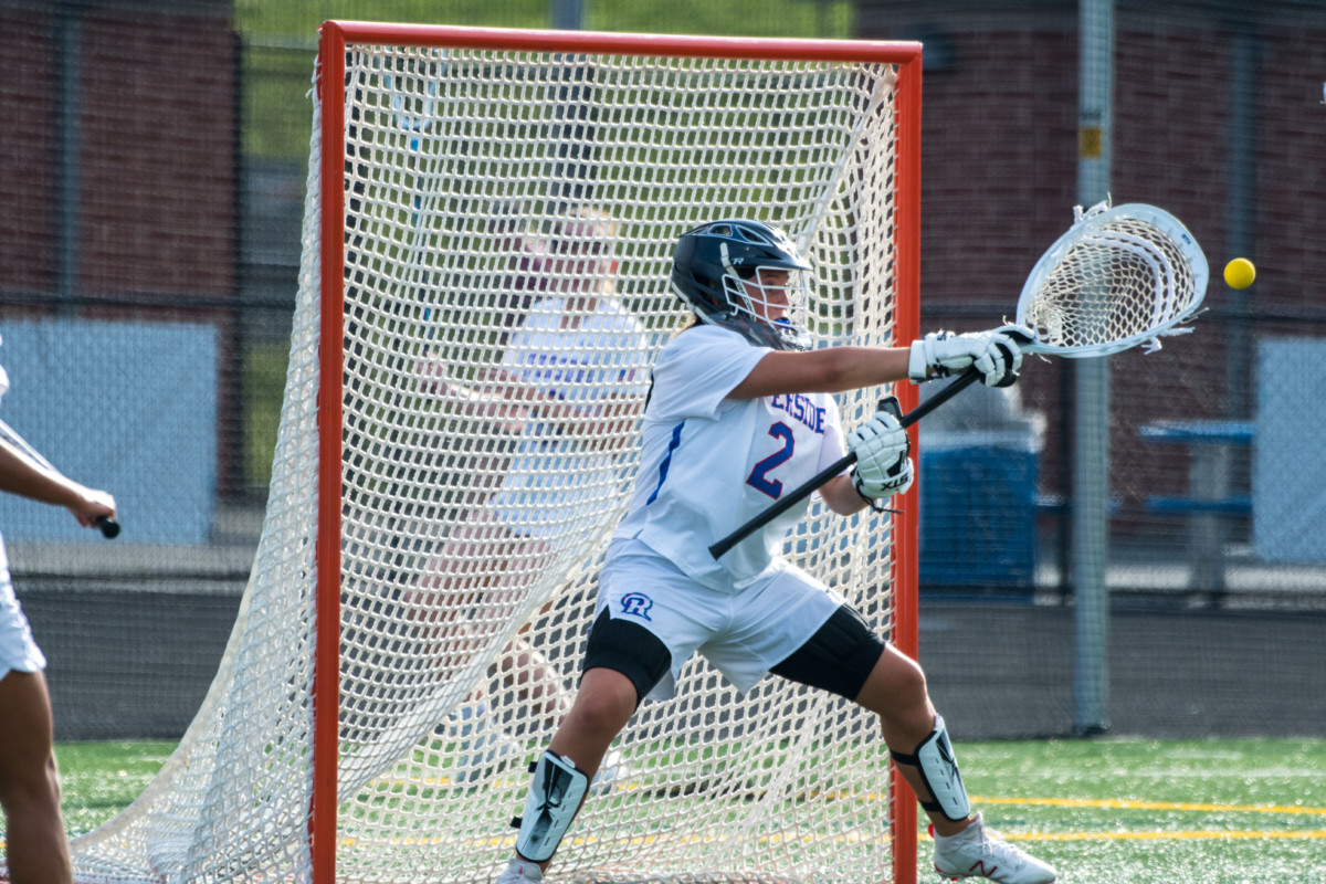 Riverside Rams Lacrosse goalie saves a shot