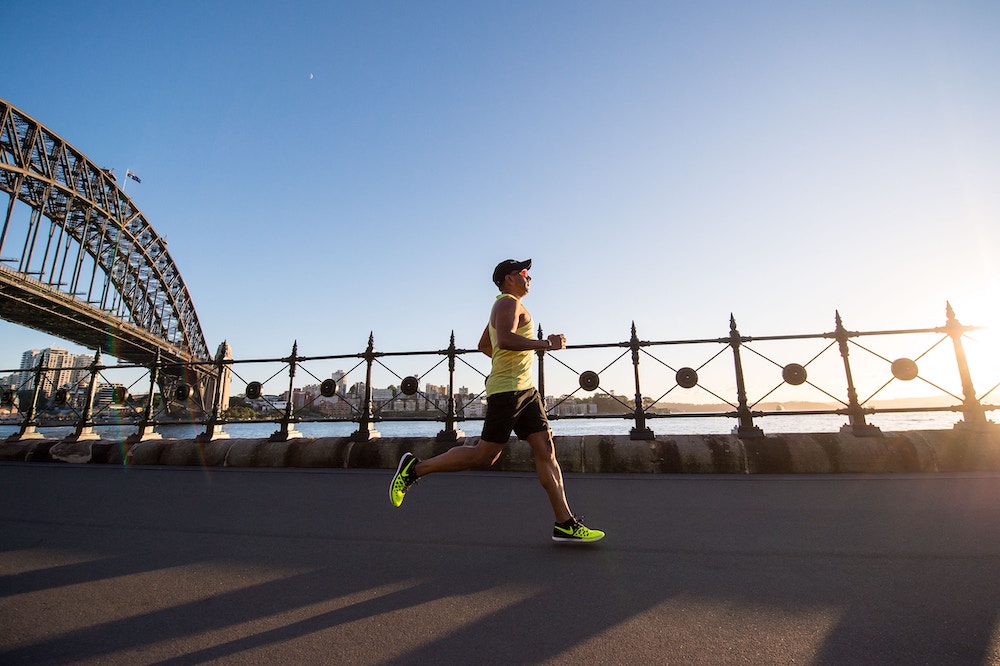 Man running on a bridge