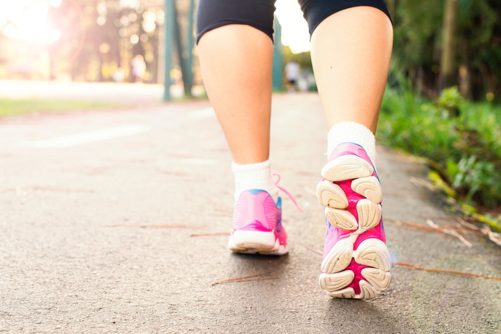 close up of woman walking in walking shoes