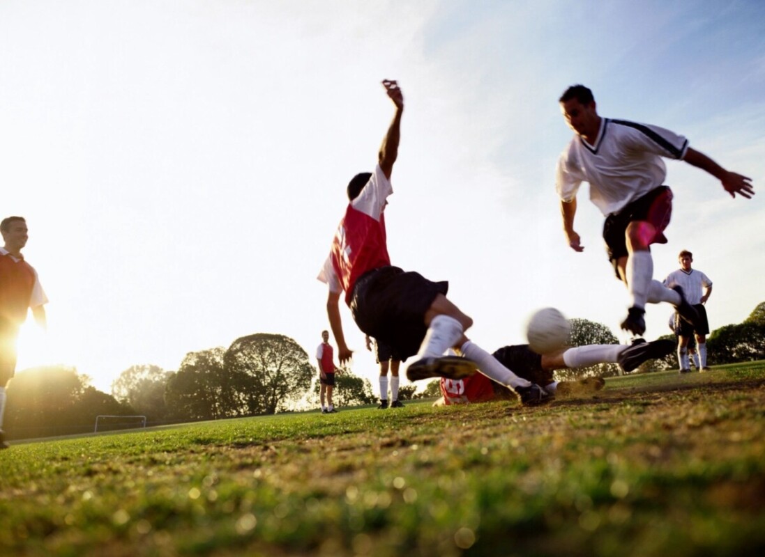 Soccer player making a slide tackle